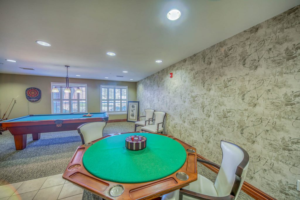 game room with pool and card tables
