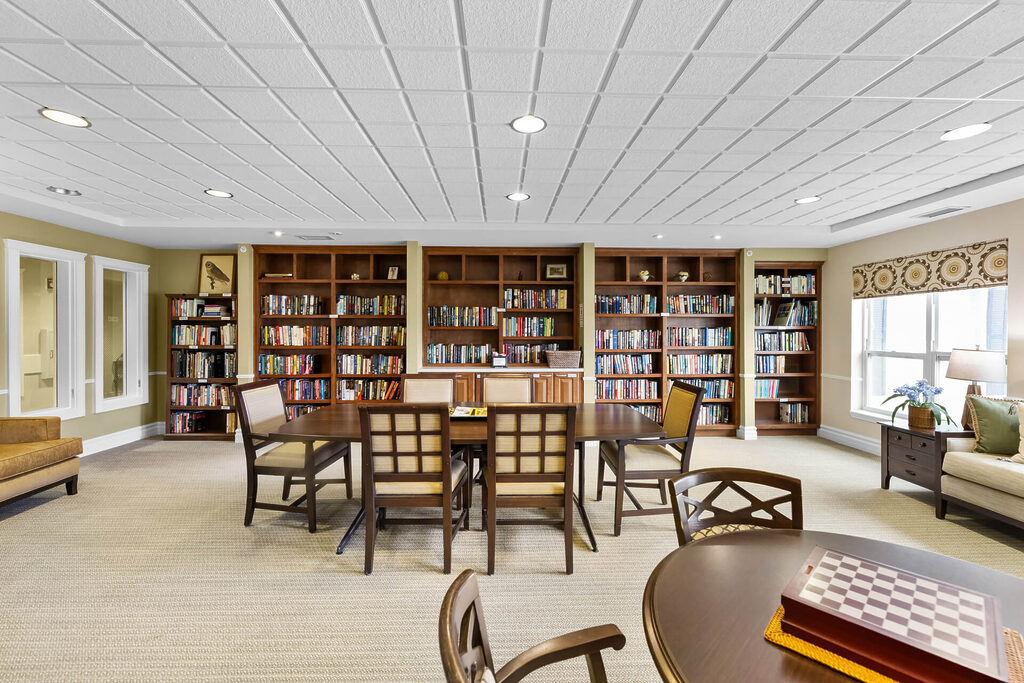 Community library with bookshelves and seating in a bright, inviting space.
