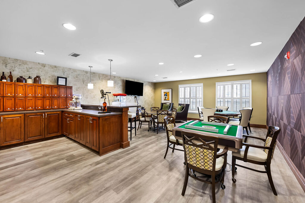 Spacious leisure room with seating, games, and a refreshment area.