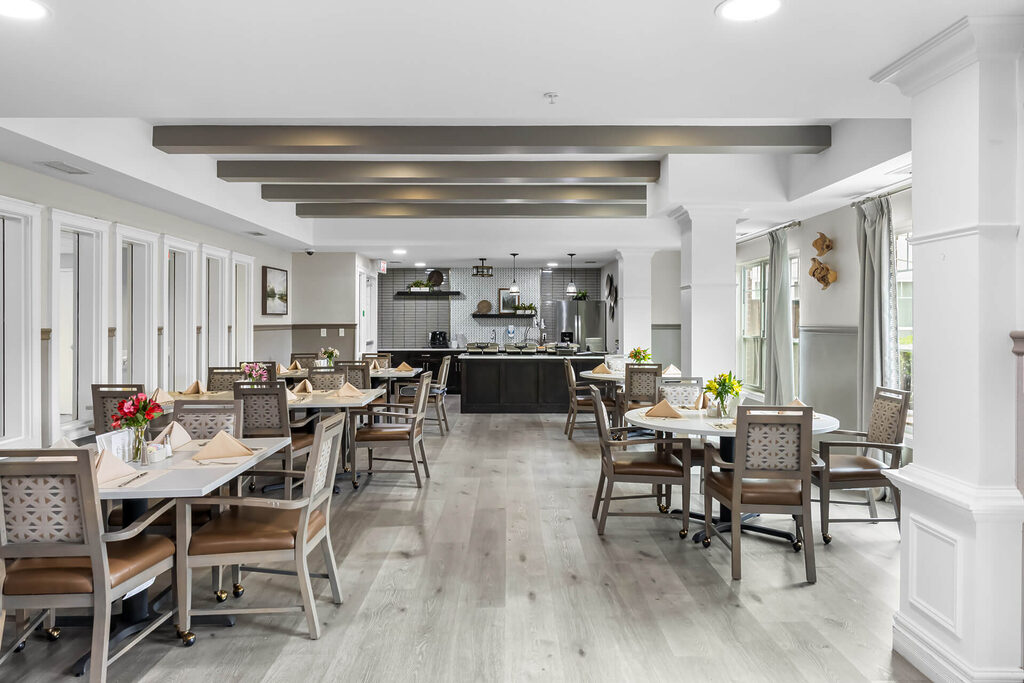 Dining area with modern decor in a senior community building.